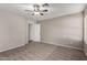 Bright bedroom with ceiling fan and plush carpeting at 574 W Kingman Dr, Casa Grande, AZ 85122