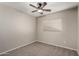 Bright bedroom with ceiling fan and window coverings at 574 W Kingman Dr, Casa Grande, AZ 85122
