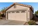 Two-car garage with arched windows and stucco exterior at 574 W Kingman Dr, Casa Grande, AZ 85122
