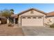 Front view of a single-story house with a two-car garage at 574 W Kingman Dr, Casa Grande, AZ 85122