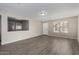 Bright living room with neutral walls and wood-look floors at 574 W Kingman Dr, Casa Grande, AZ 85122