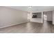 Living room with open concept kitchen and vinyl flooring at 574 W Kingman Dr, Casa Grande, AZ 85122