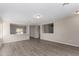 Spacious living room featuring light walls and wood-look flooring at 574 W Kingman Dr, Casa Grande, AZ 85122