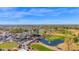 Aerial view of the community with a golf course, lake, clubhouse, and lush landscaping at 8700 E University Dr # 2020, Mesa, AZ 85207
