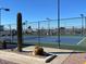 Outdoor community tennis courts enclosed with fencing for sports and recreation at 8700 E University Dr # 2020, Mesa, AZ 85207