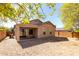 A gravel backyard with a covered patio, providing a relaxing outdoor space and easy maintenance at 26058 W Yukon Dr, Buckeye, AZ 85396