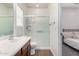 Bright bathroom featuring a single sink, toilet, and a glass-enclosed shower at 26058 W Yukon Dr, Buckeye, AZ 85396