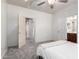 Neutral bedroom featuring a bed, closet, and an ensuite bathroom entrance at 26058 W Yukon Dr, Buckeye, AZ 85396