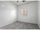 Neutral bedroom with gray carpet, white walls and window allowing for natural light at 26058 W Yukon Dr, Buckeye, AZ 85396