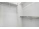 A closet with white walls and shelving space for storage at 26058 W Yukon Dr, Buckeye, AZ 85396