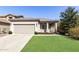 Charming single-story home featuring a neutral color palette, a two-car garage, and well-maintained landscaping at 26058 W Yukon Dr, Buckeye, AZ 85396