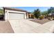 Charming single-story home with a two car garage and desert landscaping at 26058 W Yukon Dr, Buckeye, AZ 85396
