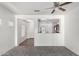 Open-concept living room with view to the kitchen at 26058 W Yukon Dr, Buckeye, AZ 85396