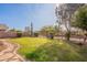 Landscaped backyard with a grassy area and stone pathway at 3011 E Colonial Pl, Chandler, AZ 85249