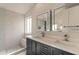 Bathroom with double vanity, quartz countertop, and walk-in shower at 3011 E Colonial Pl, Chandler, AZ 85249