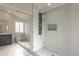 Spa-like bathroom with walk-in shower, pebble floor, and modern vanity at 3011 E Colonial Pl, Chandler, AZ 85249