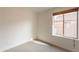 Bright bedroom with carpet flooring and a window offering natural light at 3011 E Colonial Pl, Chandler, AZ 85249