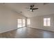 Bright living room with vinyl flooring and sliding door to patio at 3011 E Colonial Pl, Chandler, AZ 85249