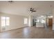 Open concept living room, kitchen, and dining area with vinyl flooring at 3011 E Colonial Pl, Chandler, AZ 85249