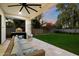 Spacious backyard with grassy lawn and a covered patio at 7240 N 13Th Ln, Phoenix, AZ 85021