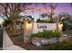 Lexia Manor community entrance sign at dusk, featuring brick pillars and landscaping at 7240 N 13Th Ln, Phoenix, AZ 85021