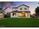 Modern farmhouse exterior with backyard and sunset view at 7240 N 13Th Ln, Phoenix, AZ 85021