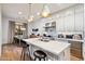 Modern kitchen with white cabinets, marble island, and stainless steel appliances at 7240 N 13Th Ln, Phoenix, AZ 85021