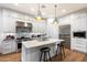 Modern kitchen with white cabinets, marble countertops, and stainless steel appliances at 7240 N 13Th Ln, Phoenix, AZ 85021