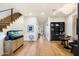 Open living space showcasing hardwood floors, modern furniture, and a staircase at 7240 N 13Th Ln, Phoenix, AZ 85021