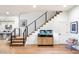 Modern staircase with cable railing and light wood steps at 7240 N 13Th Ln, Phoenix, AZ 85021
