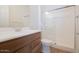 Clean bathroom with a combination shower, vanity with cabinets, and modern fixtures at 829 W Golden Ore Pass, Apache Junction, AZ 85120