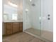 Modern bathroom featuring a glass-enclosed shower, wood-look tile flooring, and a sleek vanity at 829 W Golden Ore Pass, Apache Junction, AZ 85120