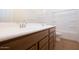 Well-lit bathroom featuring a dual sink vanity, toilet, and a glass enclosed shower at 829 W Golden Ore Pass, Apache Junction, AZ 85120