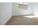 Bright bedroom featuring wood-look tile flooring, and a view to the outside at 829 W Golden Ore Pass, Apache Junction, AZ 85120