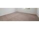 Inviting carpeted bedroom with ample natural light, providing a peaceful and comfortable space at 829 W Golden Ore Pass, Apache Junction, AZ 85120
