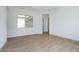 Bedroom featuring wood-look tile flooring, and a view to the outside at 829 W Golden Ore Pass, Apache Junction, AZ 85120