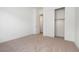 Neutral carpeted bedroom with closet, creating a blank canvas for personalization at 829 W Golden Ore Pass, Apache Junction, AZ 85120