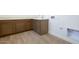 A laundry room with wood cabinets, counter, and a utility sink at 829 W Golden Ore Pass, Apache Junction, AZ 85120