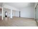 Bright, open living room with hardwood floors and an open floor plan to the kitchen at 829 W Golden Ore Pass, Apache Junction, AZ 85120