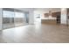 Open living room with hardwood floors, stainless appliances and a large sliding glass door at 829 W Golden Ore Pass, Apache Junction, AZ 85120