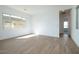 Bright living room featuring wood-look tile flooring, with views to the outside at 829 W Golden Ore Pass, Apache Junction, AZ 85120