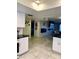 Open concept kitchen with island and view into living area at 272 Leisure World --, Mesa, AZ 85206