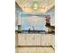 Modern kitchen with white cabinets, black countertops, and stainless steel appliances at 272 Leisure World --, Mesa, AZ 85206