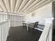 Covered front porch featuring a table and chairs for outdoor relaxation at 225 S Motherlode Dr, Apache Junction, AZ 85119