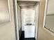 Exterior laundry closet featuring stacked washer and dryer at 225 S Motherlode Dr, Apache Junction, AZ 85119