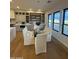Bright dining room with modern decor, cabinetry, shelving and views to the exterior through black-trimmed windows at 25219 S 194Th St, Queen Creek, AZ 85142