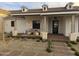 Inviting front porch with stylish seating area and charming curb appeal at 25219 S 194Th St, Queen Creek, AZ 85142