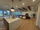 Open kitchen and living room concept, featuring hardwood floors and a large island at 25219 S 194Th St, Queen Creek, AZ 85142