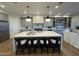 Gourmet kitchen with a large island, stylish seating, and custom cabinetry at 25219 S 194Th St, Queen Creek, AZ 85142