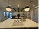 Modern kitchen overlooking an open-concept living room with abundant natural light at 25219 S 194Th St, Queen Creek, AZ 85142